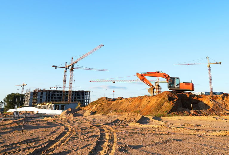Construction site with cranes and excavators