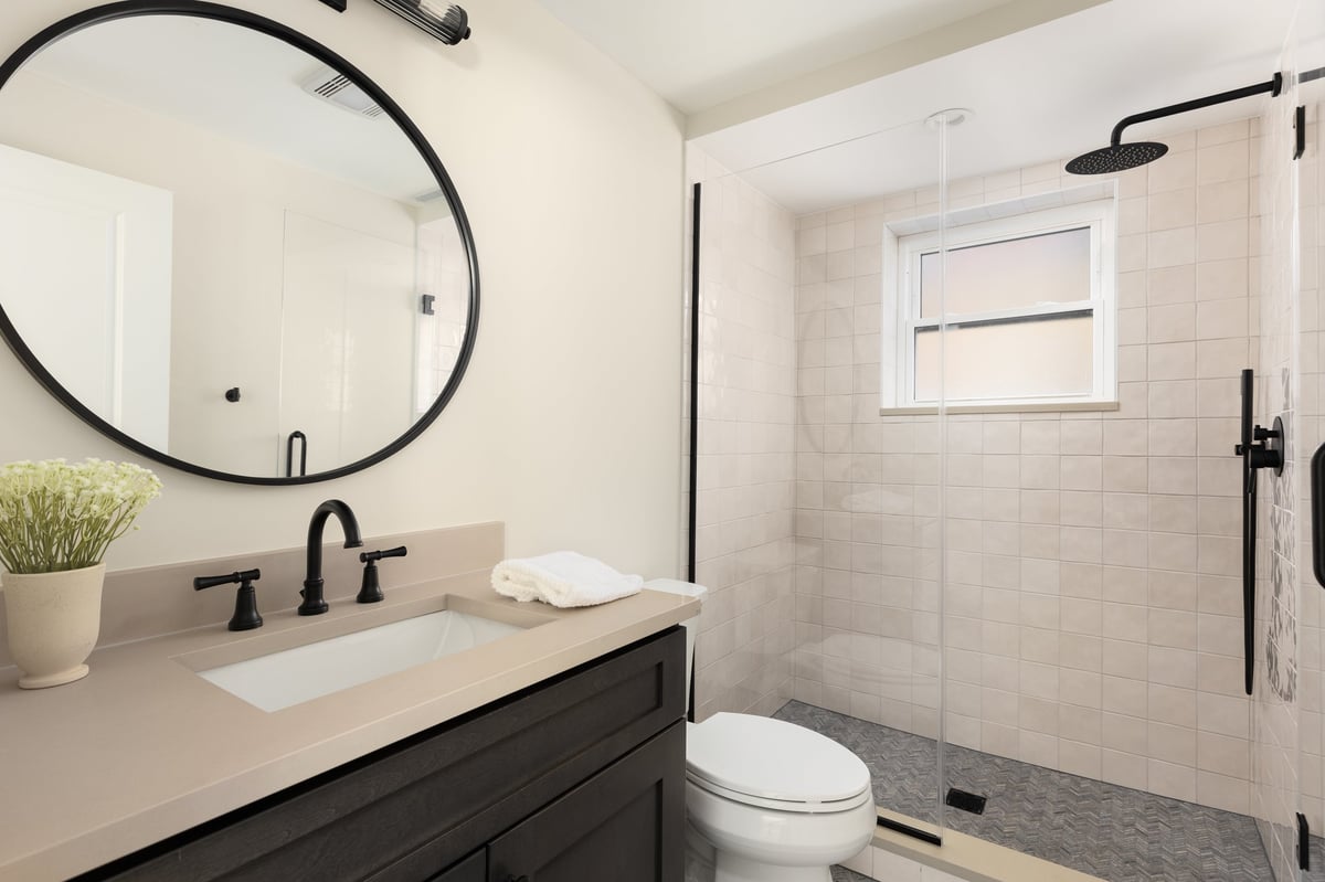 Cozy bathroom with dark wood cabinet and modern fixtures