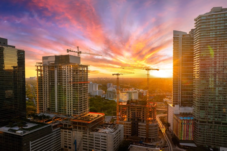 Miami high-rise buildings under construction at sunset
