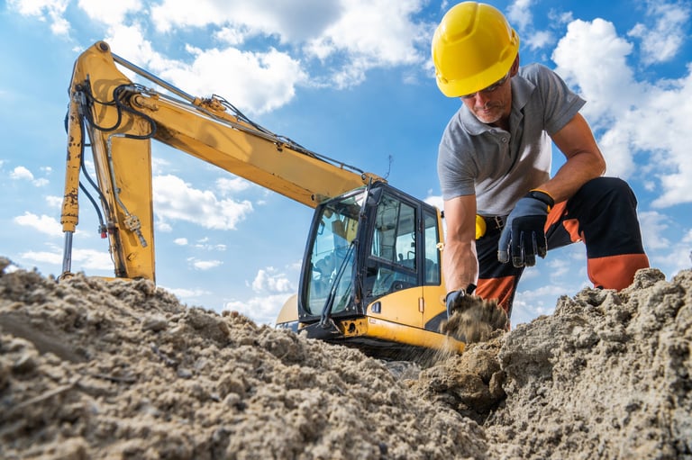 Construction worker excavating site