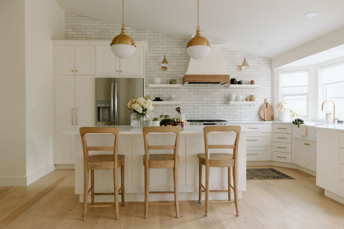 Modern farmhouse kitchen with white cabinets and bright interior