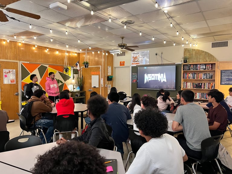 Students engaged in learning during a classroom presentation